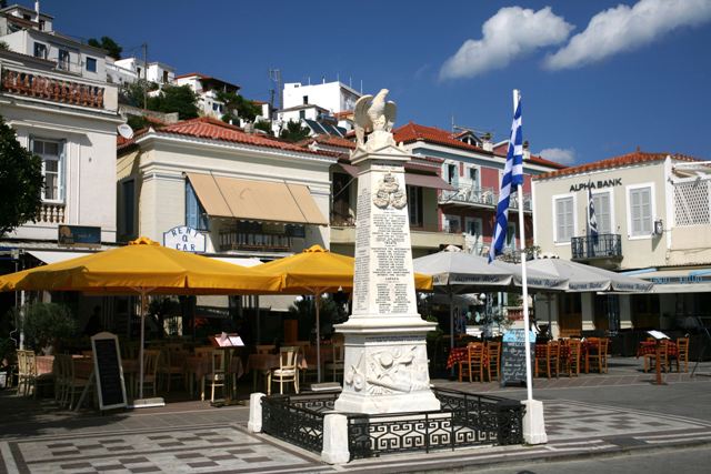 Poros Island - Waterfront war monument surrounded by cafes and tavernas